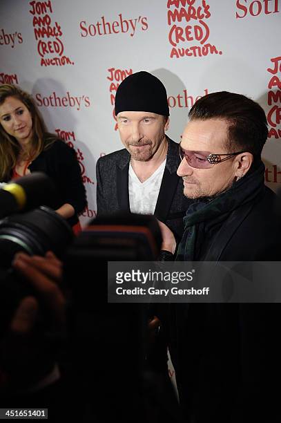 The Edge and Bono of U2 attend the 2013 Auction Celebrating Masterworks Of Design and Innovation at Sotheby's on November 23, 2013 in New York City.