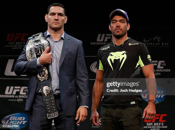 Opponents Chris Weidman and Lyoto Machida pose for photos during the UFC Ultimate Media Day at the Mandalay Bay Resort and Casino on July 3, 2014 in...