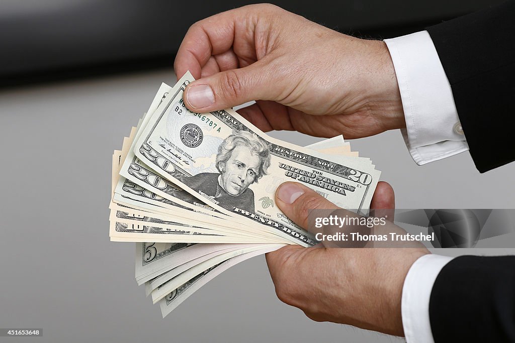 Businessman Holding US Dollars