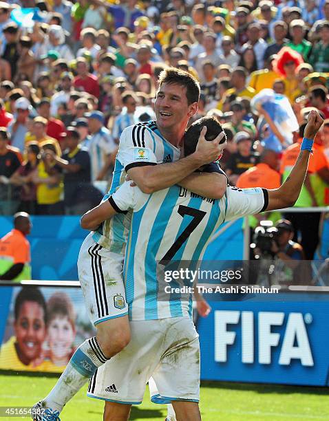 Marco di Maria of Argentina celebrates scoring his team's first goal with his teammate Lionel Messi during the 2014 FIFA World Cup Brazil Round of 16...