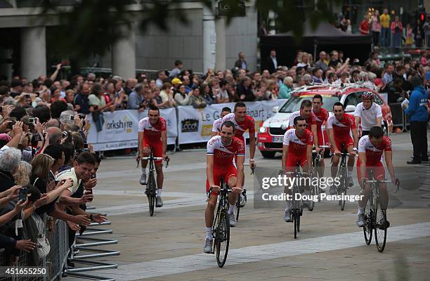 Team Cofidis is greeted by supporters as they ride through Millenium Square enroute to the Team Presentation prior to the 2014 Le Tour de France on...