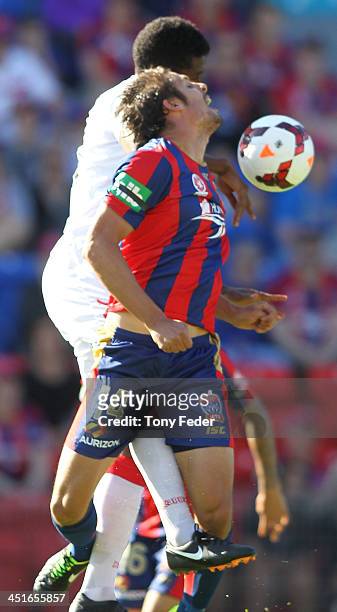 Josh Mitchell of the Jets contests the header against Heart defence during the round seven A-League match between the Newcastle Jets and the...