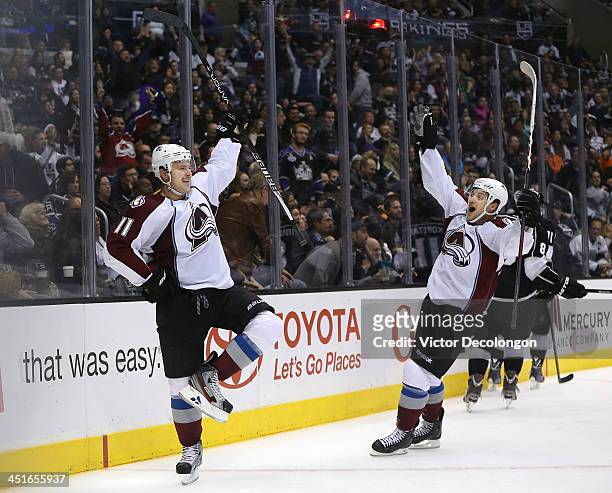 Jamie McGinn and John Mitchell of the Colorado Avalanche react after McGinn scored in overtime to defeat the Kings 1-0 in the NHL game at Staples...