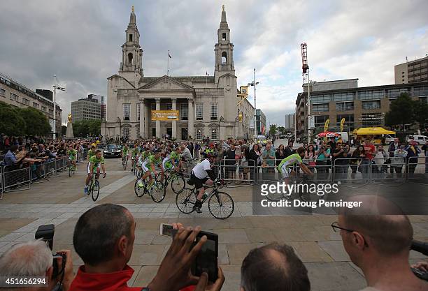 The Cannondale Pro Cycling Team is greeted by supporters as they ride through Millenium Square enroute to the Team Presentation prior to the 2014 Le...