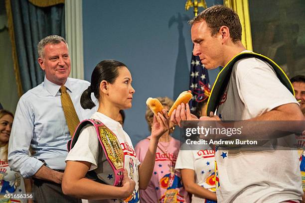 New York City's Mayor Bill De Blasio watches as Joey "Jaws" Chestnut and Sonya "The Black Widow" Thomas have a stare down a day prior to the Nathan's...