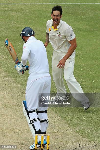 Mitchell Johnson of Australia celebrates after taking the wicket of Stuart Broad of England during day four of the First Ashes Test match between...