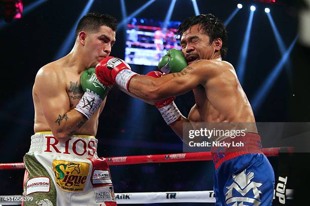 Manny Pacquiao of the Philippines punches Brandon Rios of the U.S. During their 'Clash in Cotai' WBO International Welterweight title fight on...