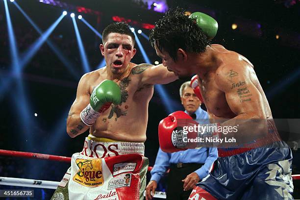 Manny Pacquiao of the Philippines fights with Brandon Rios of the U.S. During their 'Clash in Cotai' WBO International Welterweight title bout on...