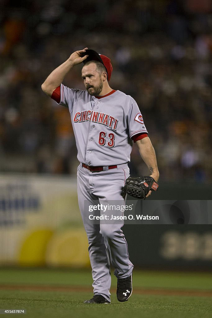 Sam Lacquer Reds Sam LeCure of the Cincinnati Reds stands behind the pitchers mound ...