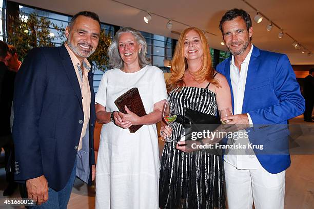 Giovanni Arvaneh, Christa Hoehs, Olivia Pascal and Peter Kanitz attend the Bulthaup Showroom Opening on July 03, 2014 in Munich, Germany.