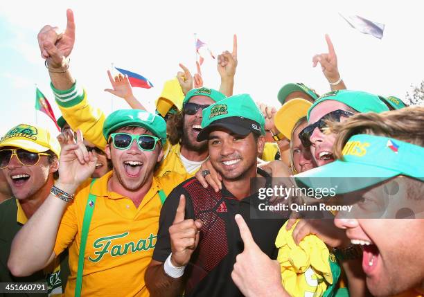 Jason Day of Australia celebrates with fans after winning the tournament during day four of the World Cup of Golf at Royal Melbourne Golf Course on...