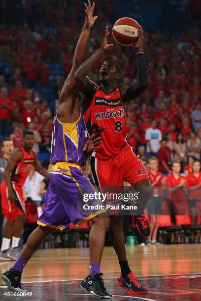 James Ennis of the Wildcats shoots the ball against Sam Young of the Kings during the round seven NBL match between the Perth Wildcats and the Sydney...