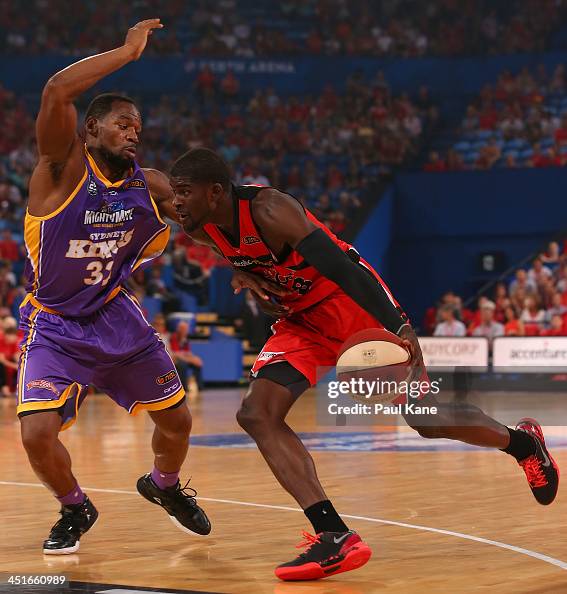 James Ennis of the Wildcats drives to the basket against Sam Young
