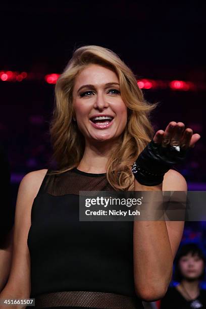 Paris Hilton watches Manny Pacquiao of the Philippines fight with Brandon Rios of the U.S. During the 'Clash in Cotai' WBO International Welterweight...