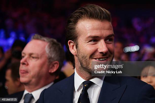 David Beckham watches Manny Pacquiao of the Philippines fight with Brandon Rios of the U.S. During the 'Clash in Cotai' WBO International...