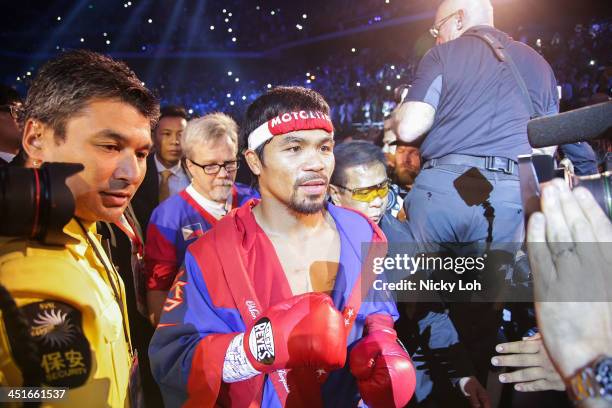 Manny Pacquiao of the Philippines walks into the ring before his bout with Brandon Rios of the U.S. During their 'Clash in Cotai' WBO International...