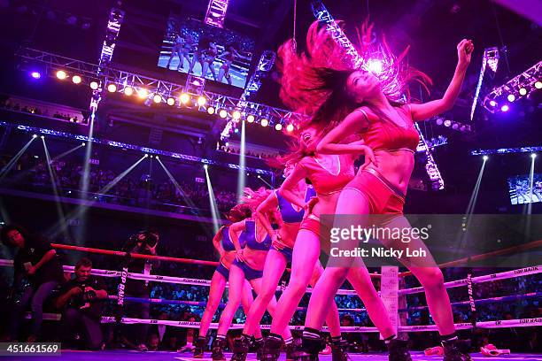 Ring girls perform during the 'Clash in Cotai' WBO International Welterweight title bout on November 24, 2013 in Macau.