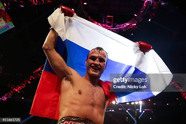 Evgeny Gradovich of Russia celebrates defeating Billy Dib of Australia during their 'Clash in Cotai' IBF Featherweight title bout on November 24,...