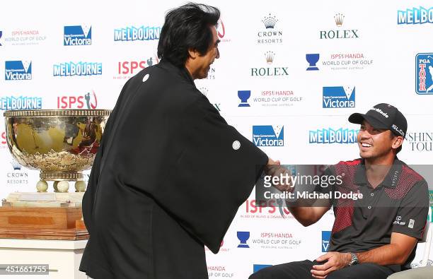 Dr Haruhisa Handa and winner Jason Day of Australia shake hands at the presentation during day four of the World Cup of Golf at Royal Melbourne Golf...