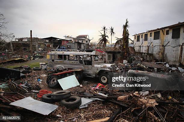 Jeepney smashed by Typhoon Haiyan lie amongst the debris in Tacloban on November 23, 2013 in Leyte, Philippines. The Jeepney is a modified form of...