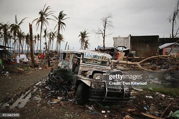 Jeepney smashed by Typhoon Haiyan lies amongst the debris in Tacloban on November 23, 2013 in Leyte, Philippines. The Jeepney is a modified form of...