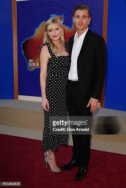 Kirsten Dunst and Garrett Hedlund pose at the "Anchorman 2: The Legend Continues" Australian premiere at The Entertainment Quarter on November 24,...
