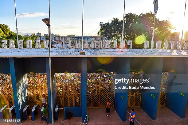 Brazilian football fans crowd outside the gate as their national team arrives for training session at the President Vargas stadium on the eve of the...