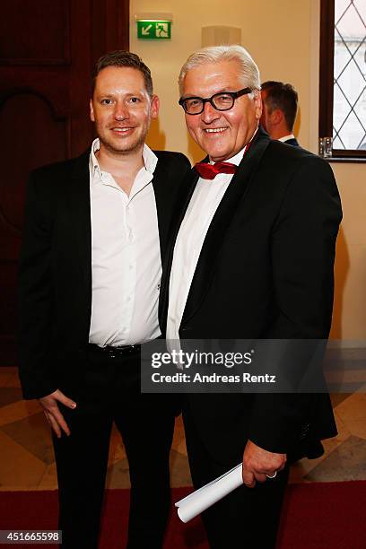 Marco Kreuzpaintner and German Foreign Minister Frank Walter Steinmeier attend the Bernhard Wicki Award at Cuvilles Theatre on July 3, 2014 in...