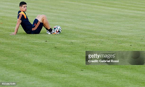 James Rodriguez of Colombia lies on the floor during a training session at Universidad de Fortaleza Stadium on July 03, 2014 in Fortaleza, Brazil....