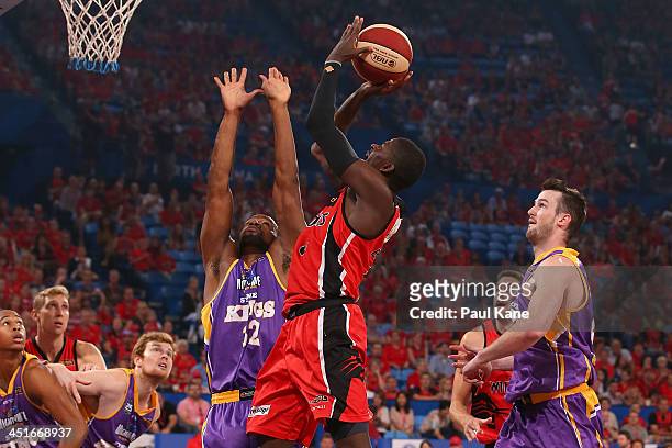 James Ennis of the Wildcats shoots the ball against Sam Young of the Kings during the round seven NBL match between the Perth Wildcats and the Sydney...