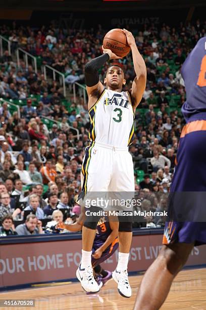 Trey Burke of the Utah Jazz shoots against the Phoenix Suns at EnergySolutions Arena on February 26, 2014 in Salt Lake City, Utah. NOTE TO USER: User...