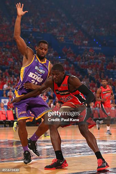 Sam Young of the Kings holds out James Ennis of the Wildcats during the round seven NBL match between the Perth Wildcats and the Sydney Kings at...