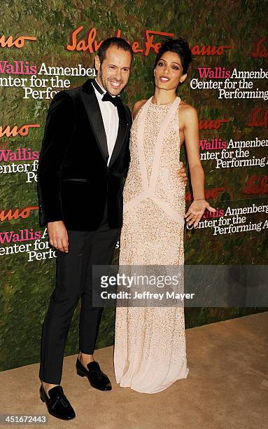 Salvatore Ferragamo Group Creative Director Massimiliano Giornetti and actress Freida Pinto arrive at the Wallis Annenberg Center For The Performing...