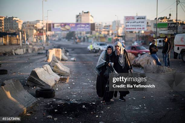 Palestinian Muslim worshippers cross the Qalandia checkpoint on their way to Jerusalem on July 4, 2014 near Ramallah, West Bank. Usually thousands of...