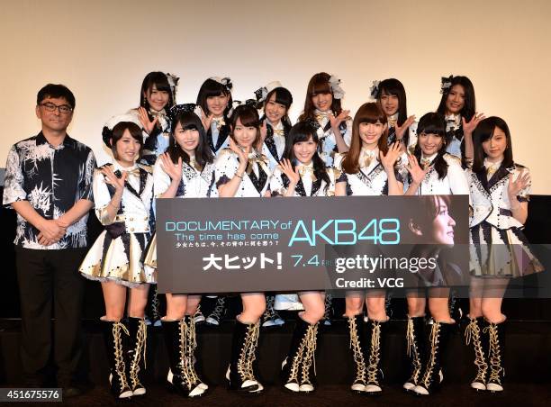 Members of AKB48 and director Eiki Takahashi attend their documentary "The time has come" press conference at Roppongi Hills on July 3, 2014 in...