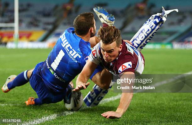 Clinton Gutherson of the Eagles dives to score a try during the round 17 NRL match between the Canterbury Bulldogs and the Manly Sea Eagles at ANZ...