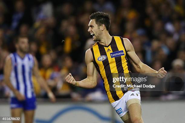 Jack Gunston of the Hawks celebrates a goal during the round 16 AFL match between North Melbourne Kangaroos and the Hawthorn Hawks at Etihad Stadium...