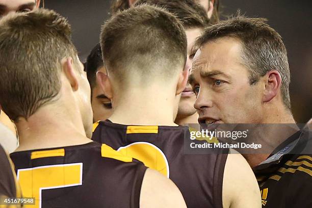 Hawks coach Alastair Clarkson addresses the players during the round 16 AFL match between North Melbourne Kangaroos and the Hawthorn Hawks at Etihad...