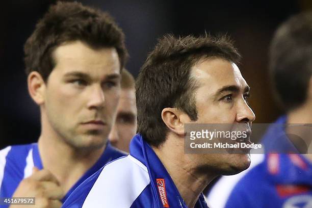 Kangaroos coach Brad Scott gets angry in the huddle at three quarter time during the round 16 AFL match between North Melbourne Kangaroos and the...
