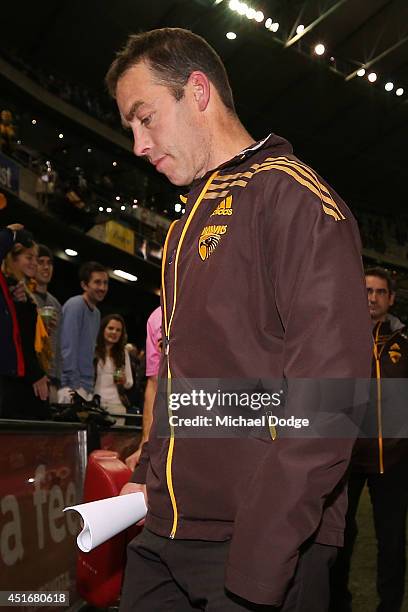 Hawks coach Alastair Clarkson walks off after their defeat during the round 16 AFL match between North Melbourne Kangaroos and the Hawthorn Hawks at...