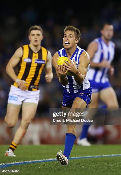 Andrew Swallow of the Kangaroos marks the ball during the round 16 AFL match between North Melbourne Kangaroos and the Hawthorn Hawks at Etihad...