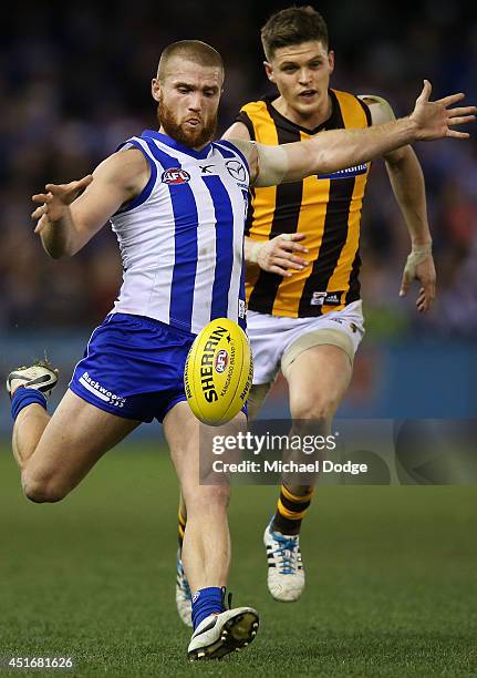 Leigh Adams of the Kangaroos kicks the ball during the round 16 AFL match between North Melbourne Kangaroos and the Hawthorn Hawks at Etihad Stadium...