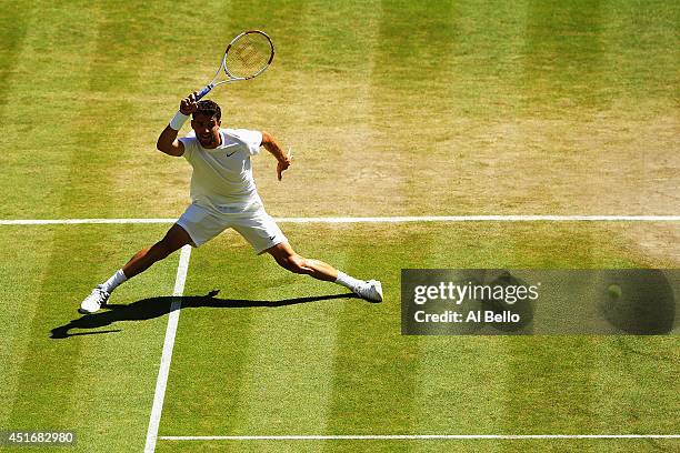 Grigor Dimitrov of Bulgaria during his Gentlemen's Singles semi-final match against Novak Djokovic of Serbia on day eleven of the Wimbledon Lawn...