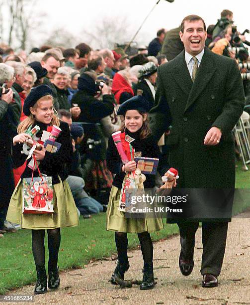 Prince Andrew, Duke of York, with daughters Princess Beatrice, and Princess Eugenie attend the annual Christmas Day service at Sandringham Church, on...