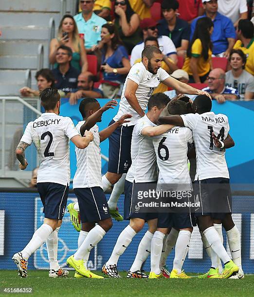 Karim Benzema of France joins in on Paul Pogba's goal celebration during the 2014 FIFA World Cup Brazil Round of 16 match between France and Nigeria...