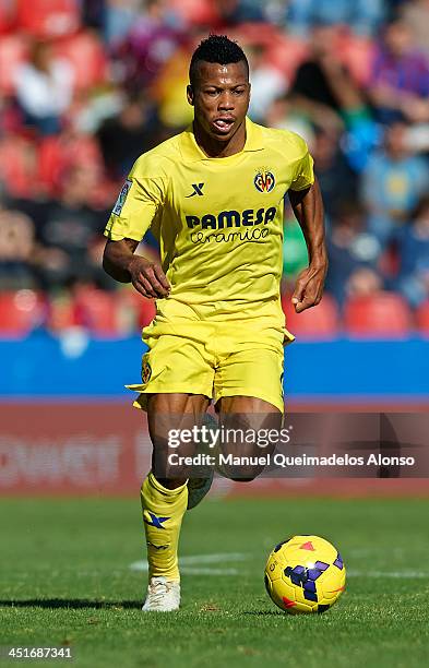 Ikechukwu Uche of Villarreal runs with the ball during the La Liga match between Levante UD and Villarreal CF at Ciutat de Valencia on November 24,...