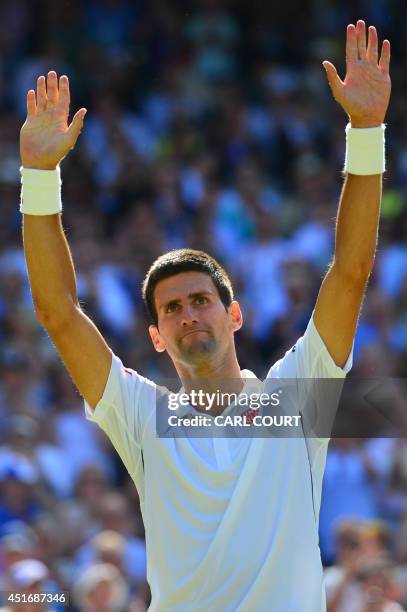 Serbia's Novak Djokovic celebrates winning his men's singles semi-final match against Bulgaria's Grigor Dimitrov during their on day 11 of the 2014...