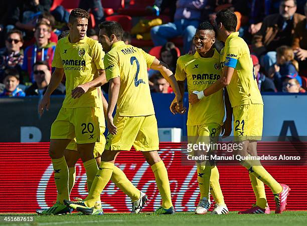 Ikechukwu Uche of Villarreal celebrates the third goal with his team-mates Bruno , Mario Gaspar and Gabriel during the La Liga match between Levante...