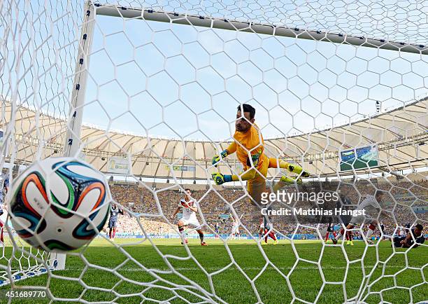 Mats Hummels of Germany scores his team's first goal past Hugo Lloris of France during the 2014 FIFA World Cup Brazil Quarter Final match between...