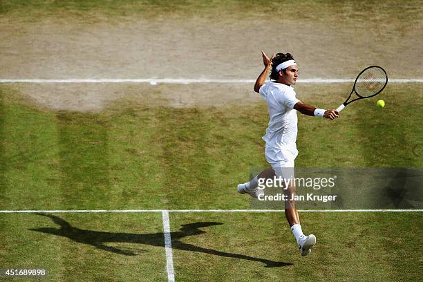 Roger Federer of Switzerland during his Gentlemen's Singles semi-final match against Milos Raonic of Canada on day eleven of the Wimbledon Lawn...